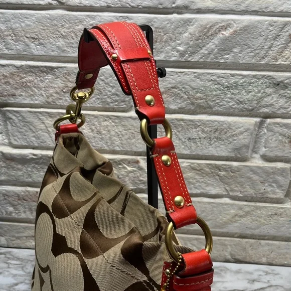 Coach Carly Signature Hobo Bag with red leather trim and gold-tone hardware. - Picture 4 of 14